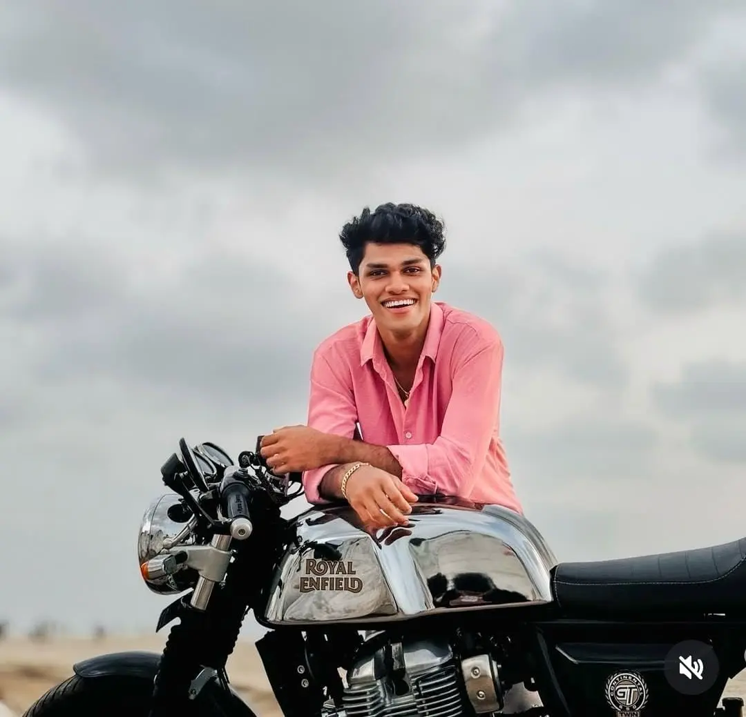 testimonial image of a man giving pose with his bike digital marketing freelancer in coimbatore
